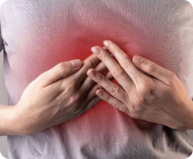 Person experiencing chest pain, holding their chest with discomfort, in New York City