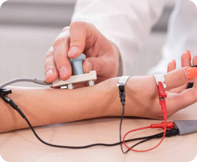 Healthcare professional applying electrotherapy treatment to a patient's arm using electrodes in New York City